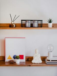 Decorative items on two wooden shelves